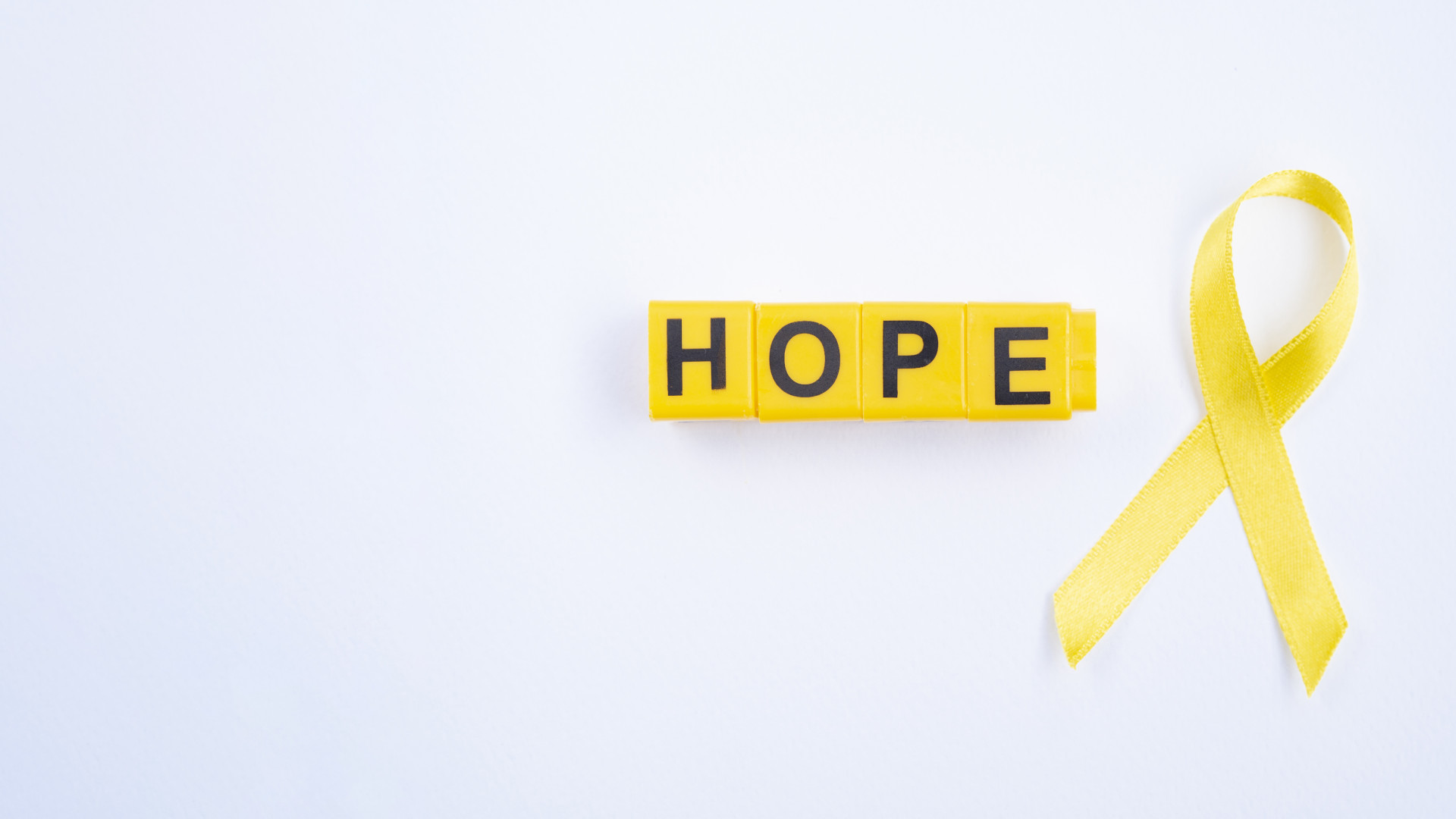 laço amarelo da luta contra o cancro nos jovens e crianças