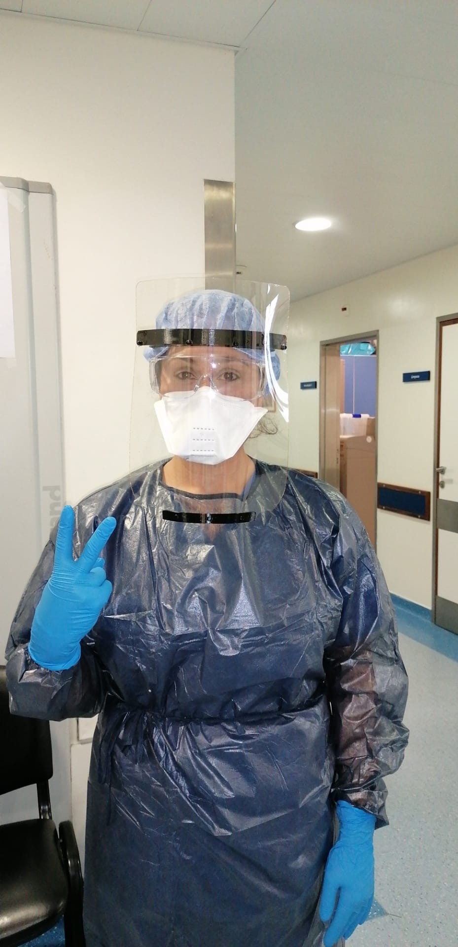 woman with visor in hospital environment